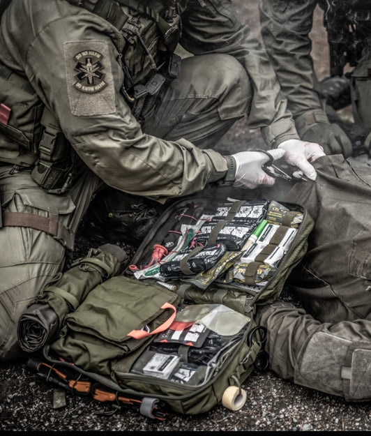 Tactical medic cutting uniform with trauma shears